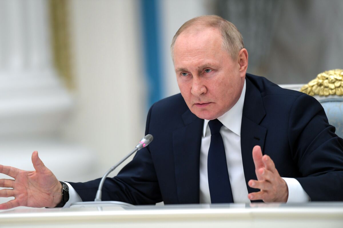 Russian President Vladimir Putin gestures as he speaks to members of the State Duma and the Federal Assembly of The Russian Federation in the Kremlin in Moscow, Russia, Thursday, July 7, 2022. (Alexei Nikolsky, Sputnik, Kremlin Pool Photo via AP)