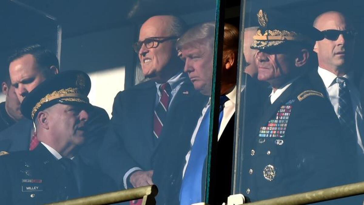 President-elect Donald Trump attends the 117th Army-Navy football game with former New York City Mayor Rudy Giuliani in Baltimore on Dec. 10, 2016.
