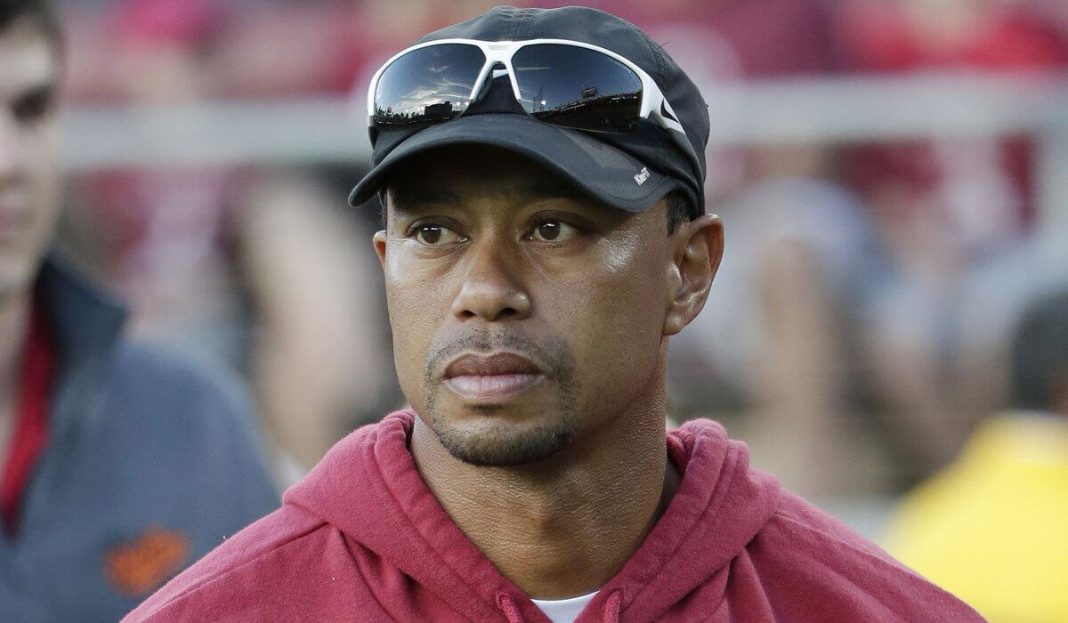 Tiger Woods, shown at a Stanford football game in October, hasn't played competitive golf since August.