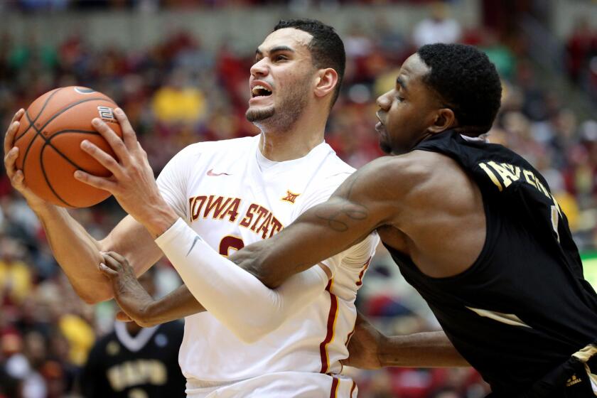 Iowa State forward Abdel Nader (2) is fouled by Arkansas-Pine Bluff guard Charles Jackson (1) as he goes up for a shot during the first half.