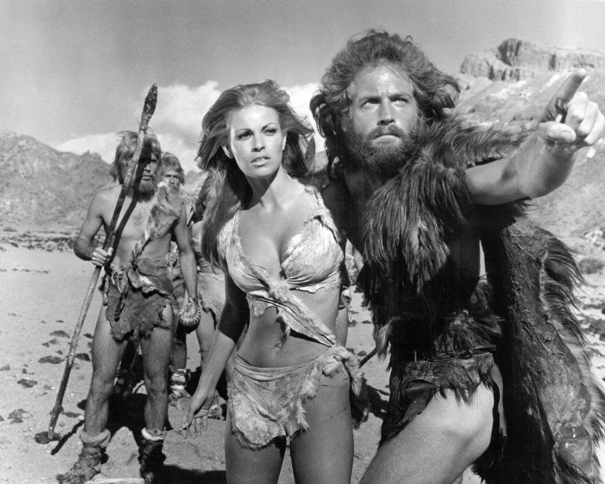 American actress Raquel Welch as Loana, and English actor John Richardson as Turak, in 'One Million Years BC', 
