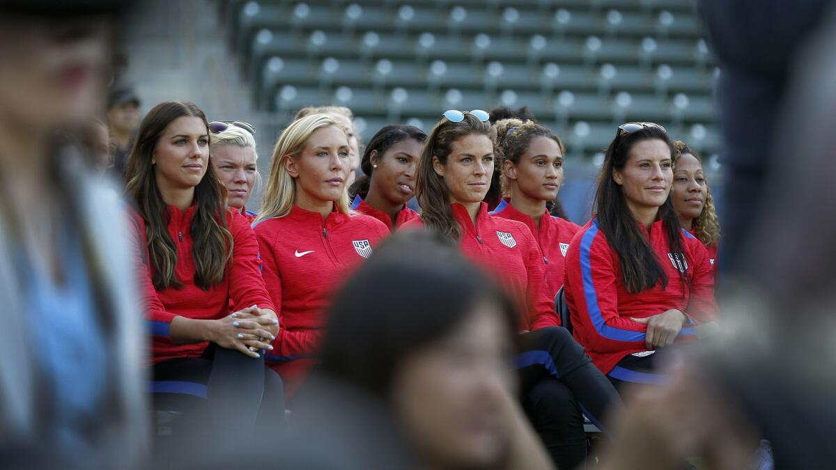Members of the U.S. women's soccer team attend a 2017 press conference where officials discuss winning the bid to host the 2028 Olympic and Paralympic Games in Los Angeles.