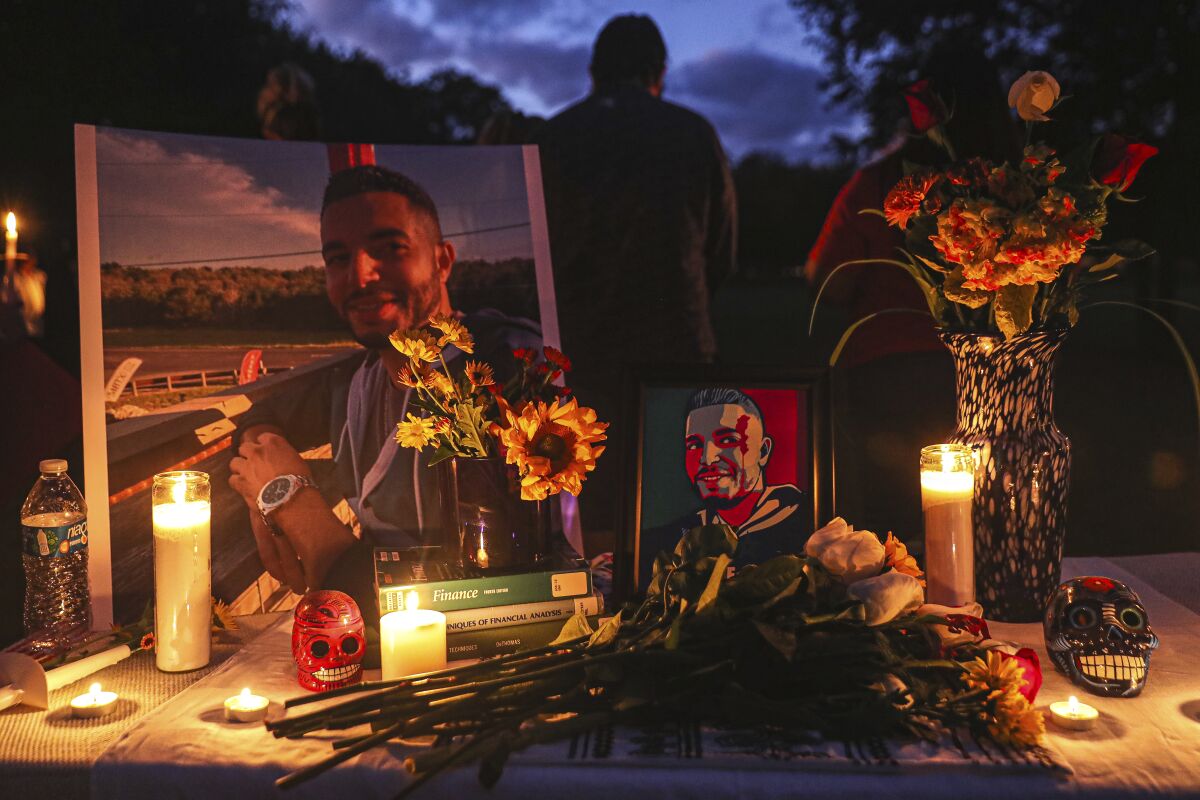 A Mexican-style ofrenda is set up at a vigil for Adil Dgoughi in Martindale, Texas on Oct. 24, 2021. A grand jury has indicted a Texas man on a first-degree murder charge in the fatal shooting of a driver who had pulled into his driveway. Terry Duane Turner was indicted Wednesday, Feb. 9, 2022 for the October shooting death of 31-year-old Adil Dghoughi, a Moroccan immigrant who lived in Austin. (Aaron E. Martinez/Austin American-Statesman via AP)