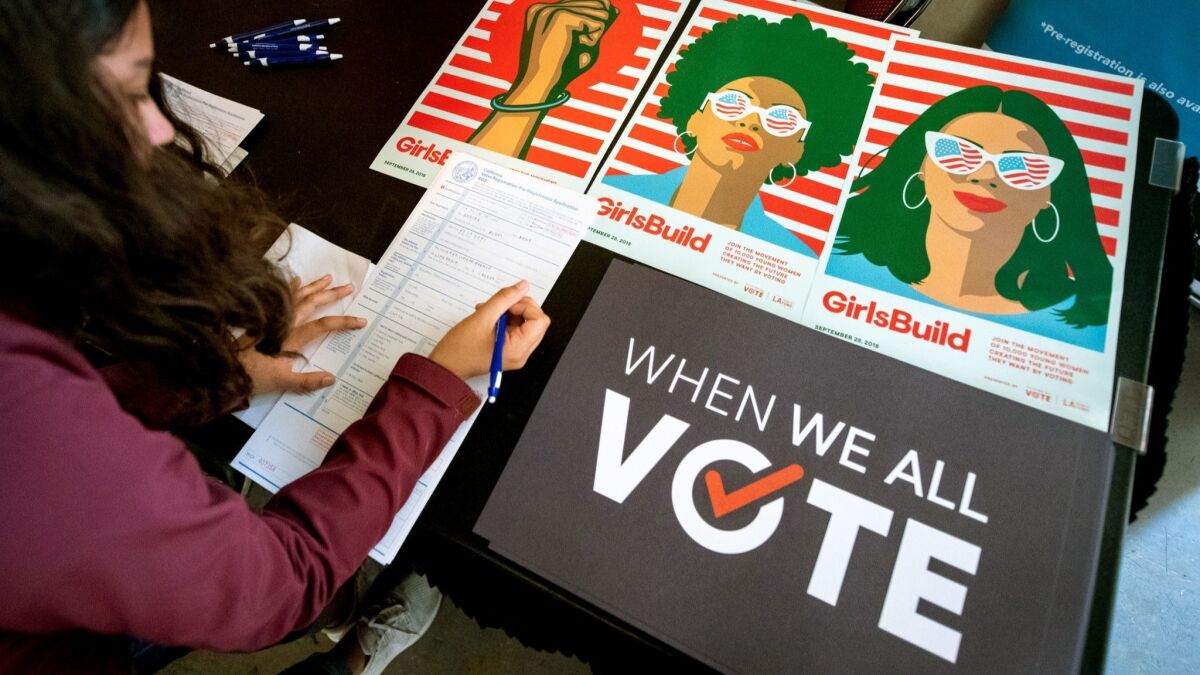 A 17-year-old high school student pre-registers to vote -- meaning her registration will become active once she turns 18 -- at a teen leadership event at USC in September.