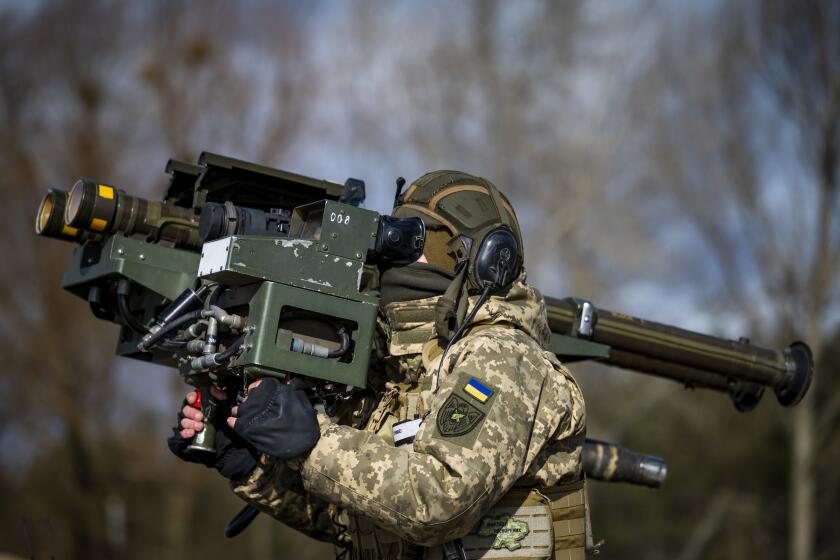 Private R, the missile operator of a Kyiv-area air defense unit, demonstrates the use of dual-mounted stinger missiles during an interview with media at an unused position about 25 miles from Kyiv on February 21, 2023 in Ukraine.