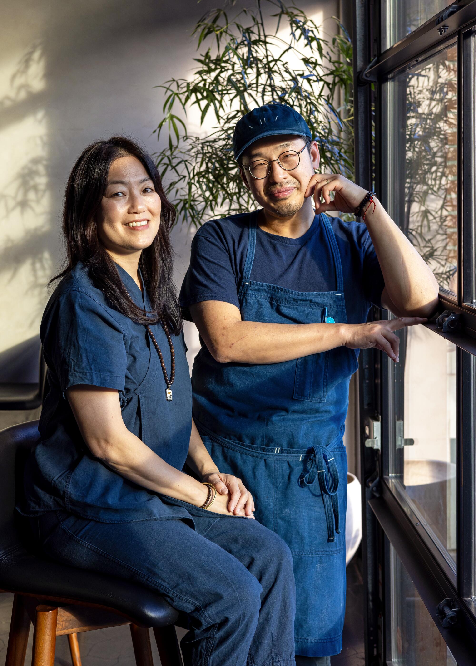 Baroo owners chef Kwang Uh, right, and Mina Park, a husband-and-wife restaurateur team, pose for a portrait.