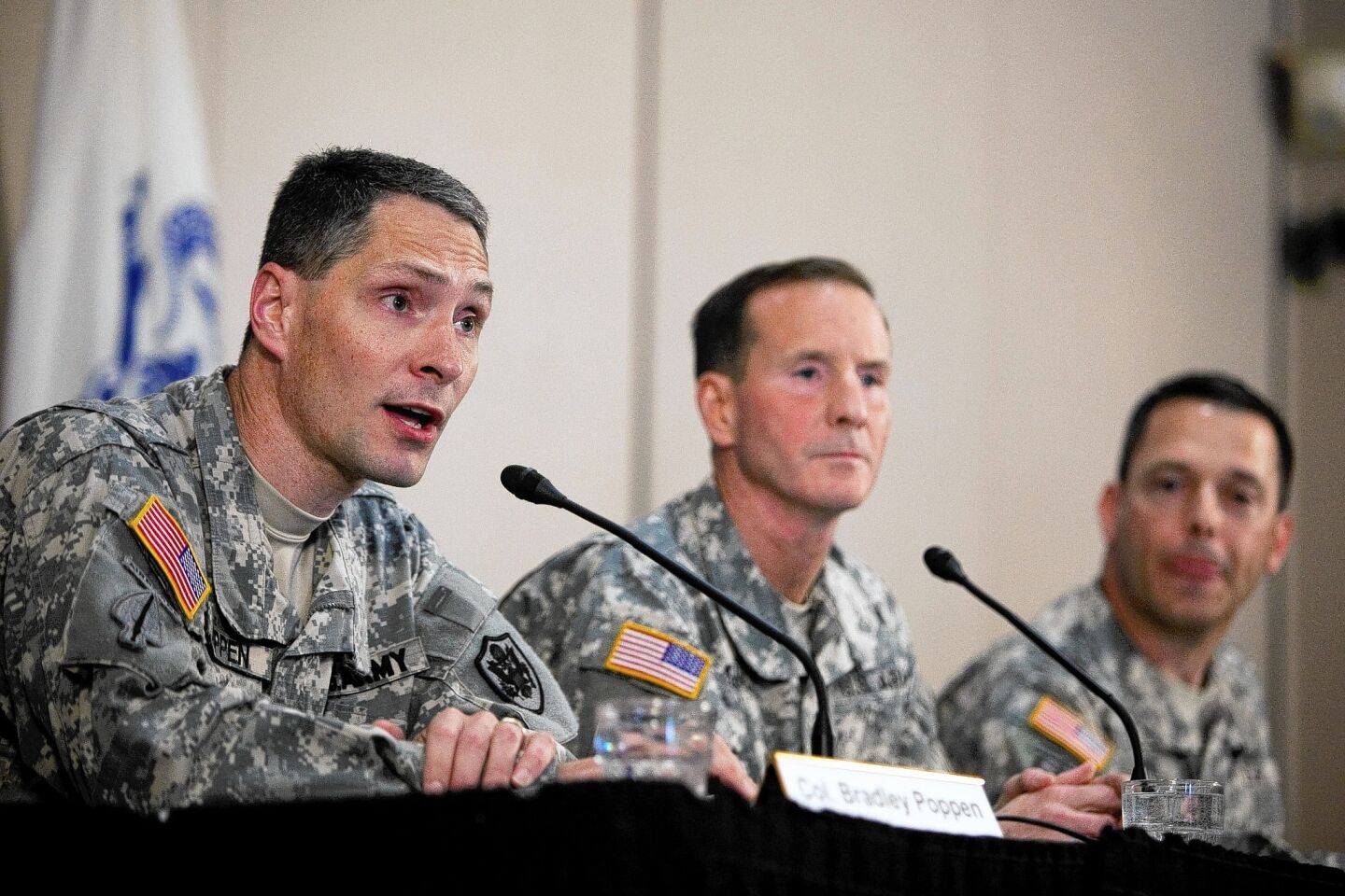 Col. Bradley Poppen, left, Maj. Gen. Joseph P. DiSalvo and Col. Ronald Wool discuss the condition of Sgt Bowe Bergdahl at a news conference at Ft. Sam Houston in San Antonio.