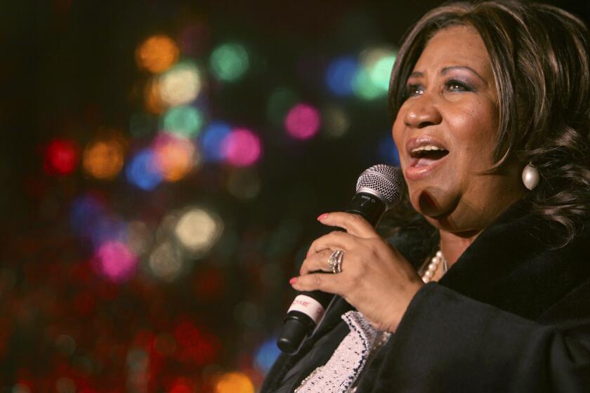 FILE - In this Dec. 4, 2008 file photo, Aretha Franklin performs during the 85th annual Christmas tree lighting at the New York Stock Exchange in New York. In a decision made Monday, Nov. 28, 2023, Judge Jennifer Callaghan who overseeing the estate of Aretha Franklin assigned real estate to the late music superstar's sons, saying she was following the wishes of a 2014 handwritten will that was found in couch cushions. (AP Photo/Mary Altaffer, File)