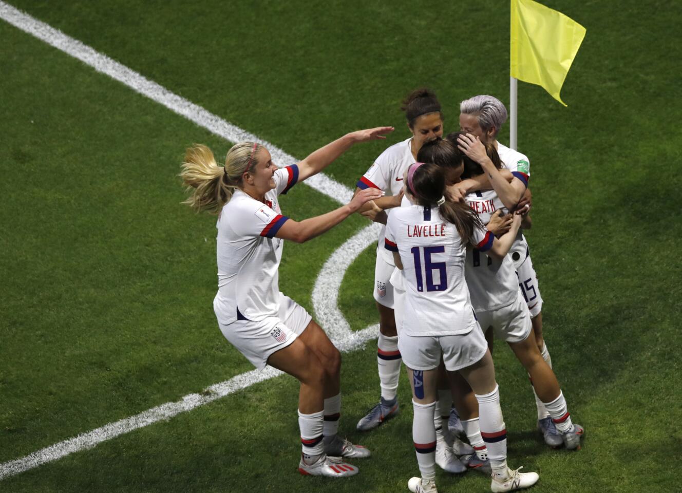 U.S. players celebrate after Tobin Heath scores the team's second goal during a Women's World Cup match against Sweden in France on June 20.