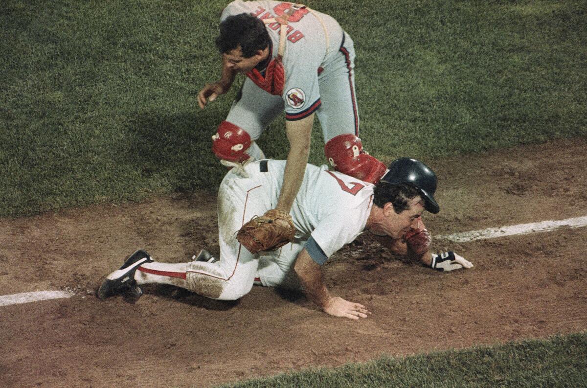 Boston's Marty Barrett is tagged out on a rundown play by Angels catcher Bob Boone during Game 6 of the 1986 ALCS.