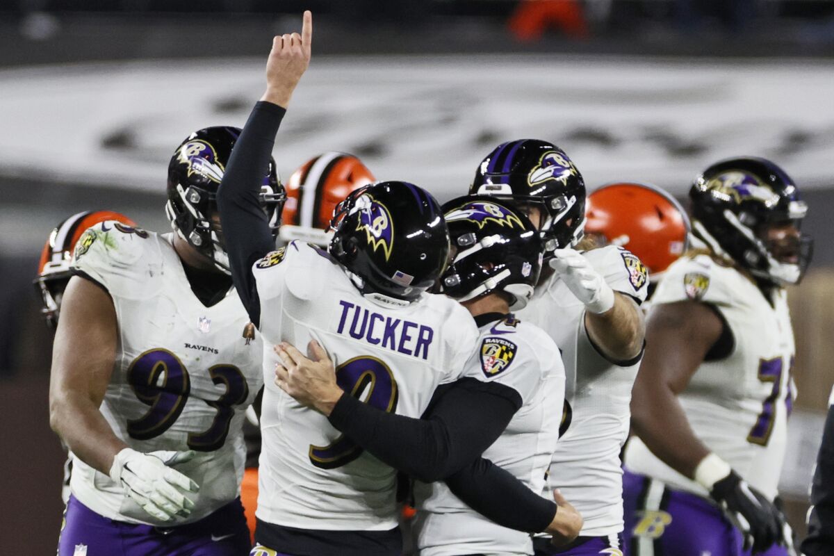 Baltimore Ravens kicker Justin Tucker (9) celebrates with teammates after kicking a 55-yard field goal during the second half of an NFL football game against the Cleveland Browns, Monday, Dec. 14, 2020, in Cleveland. The Ravens won 47-42. (AP Photo/Ron Schwane)
