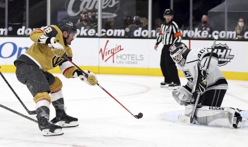 Vegas Golden Knights left wing William Carrier (28) shoots as Los Angeles Kings goalie Calvin Petersen (40) defends during the second period of an NHL hockey game Sunday, Feb. 7, 2021, in Las Vegas. (AP Photo/Isaac Brekken)