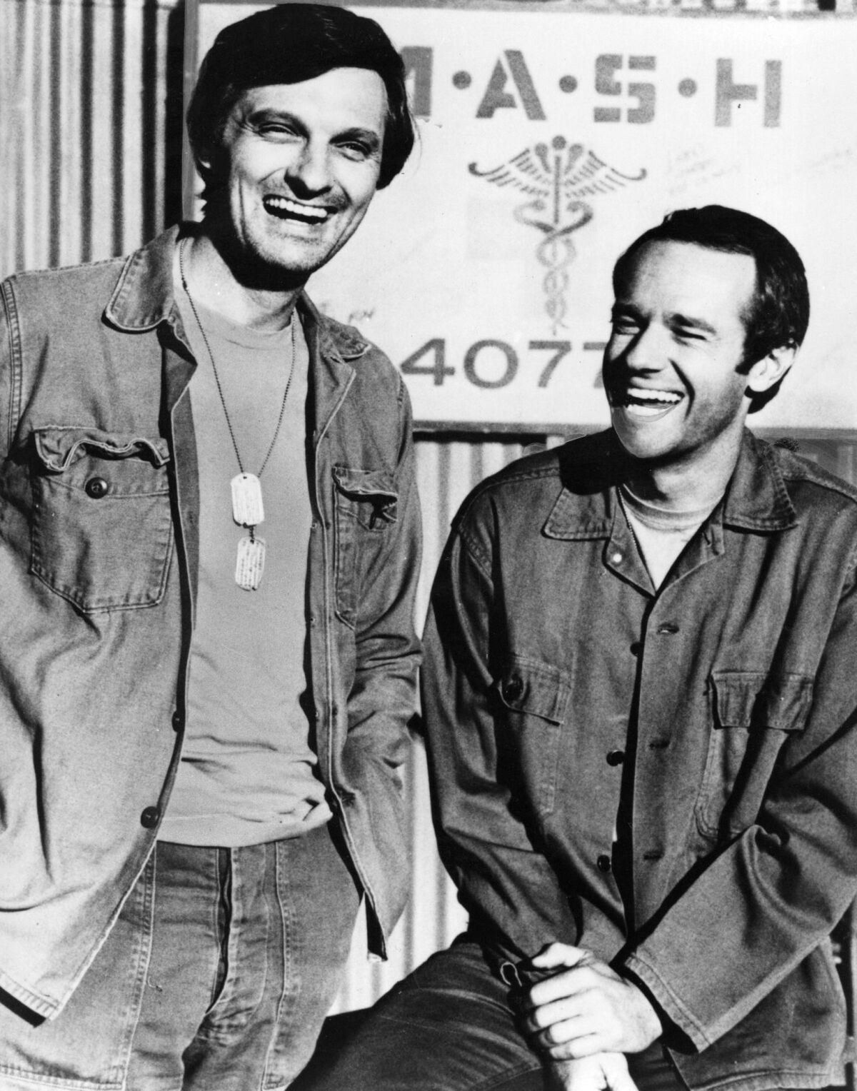 Alan Alda, left, and Mike Farrell in the TV program "MASH." (CBS)