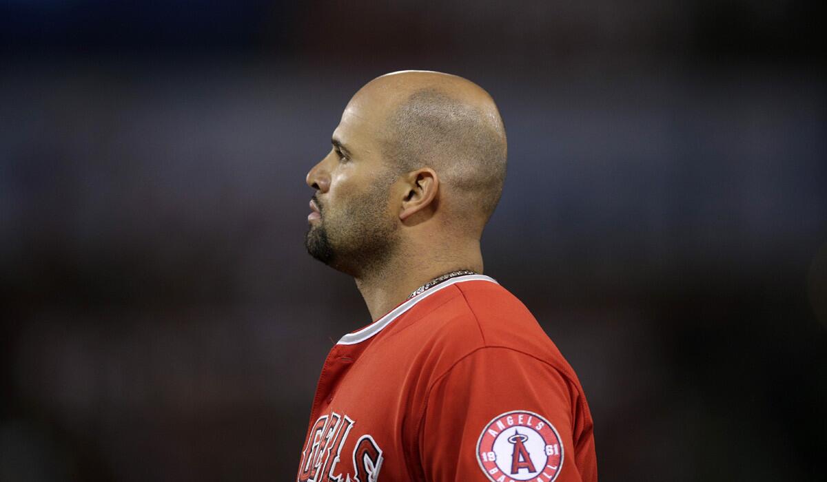 Los Angeles Angels' Albert Pujols looks away during the fifth inning against the Houston Astros on Tuesday. The Angels lost, 13-3.