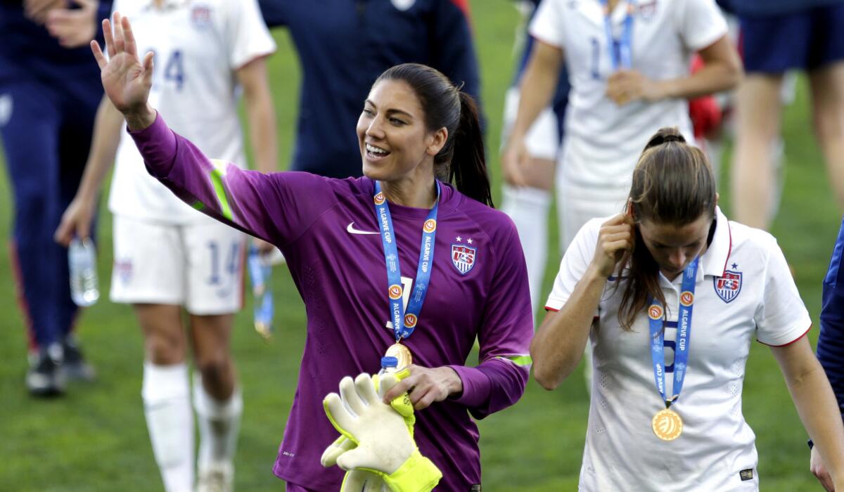 Goalkeeper Hope Solo acknowledges fans after the U.S. defeated France, 2-0, in the championship match of the Algarve Cup on March 11.