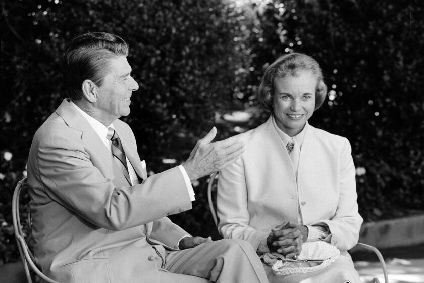 President Reagan presents his Supreme Court nominee Sandra Day O'Connor to members of the press in 1981. 