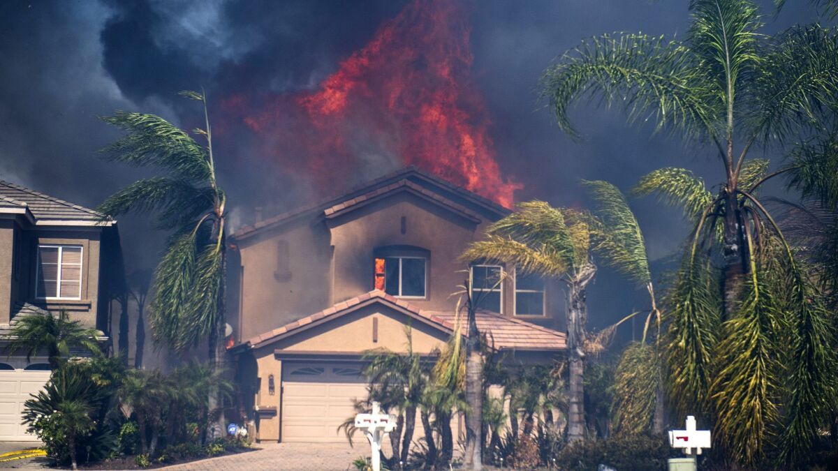 A home burns in Anaheim Hills in 2017 after embers from the Canyon 2 fire caused the roof to catch on fire.