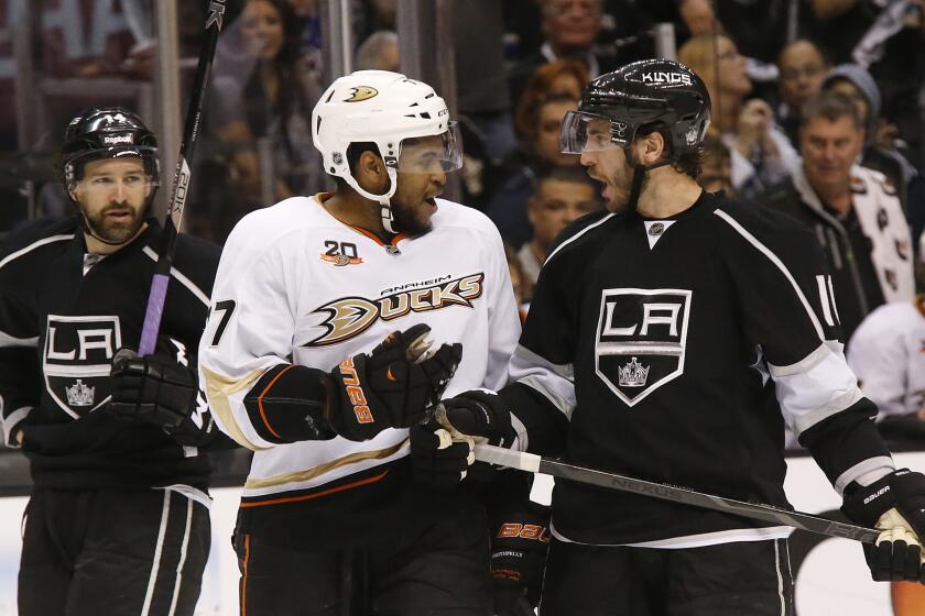 Ducks forward Devante Smith-Pelly, left, and Kings center Mike Richards talk to each other during Game 4 of their playoff series.
