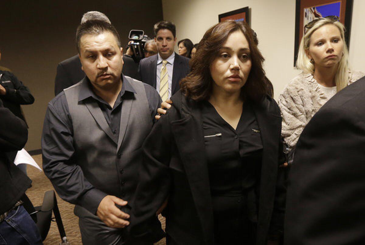 Rodrigo Lopez, left, and Sujay Cruz, parents of Andy Lopez, leave after speaking at a news conference in San Francisco on Monday.