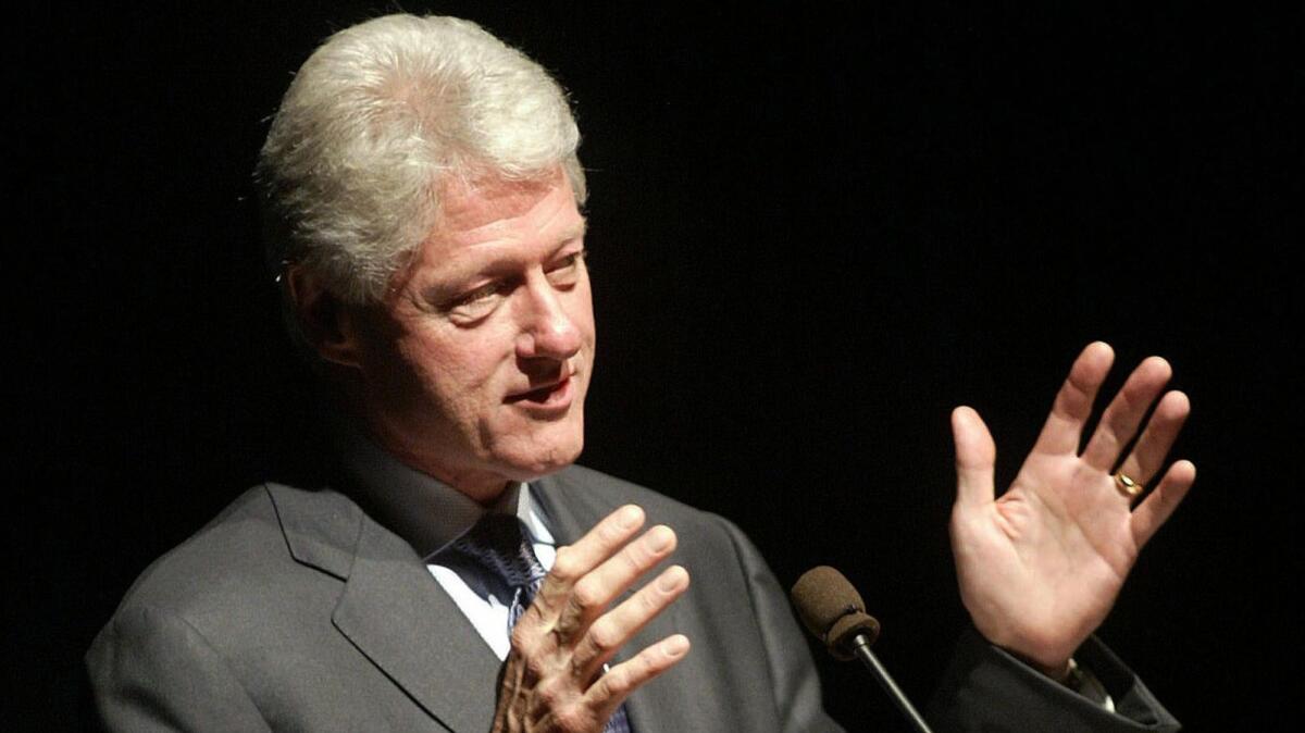Former U.S. President Bill Clinton speaks to about 1600 people in Winnipeg Tuesday Dec. 9, 2003. Clinton says the western developed countries must share more of their resources with poorer countries, or face more wars. (AP Photo/Ken Gigliotti)