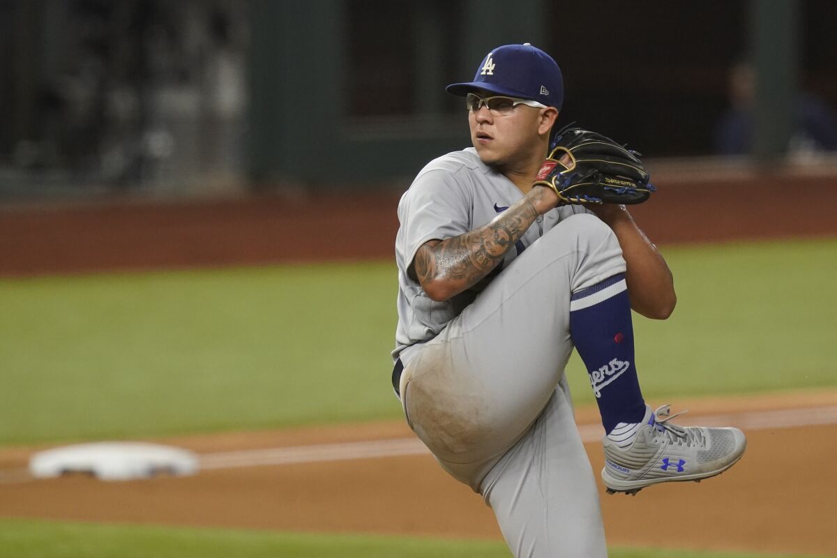 Dodgers starting pitcher Julio Urías delivers during the fourth inning of Game 3 of the NLCS against the Atlanta Braves.