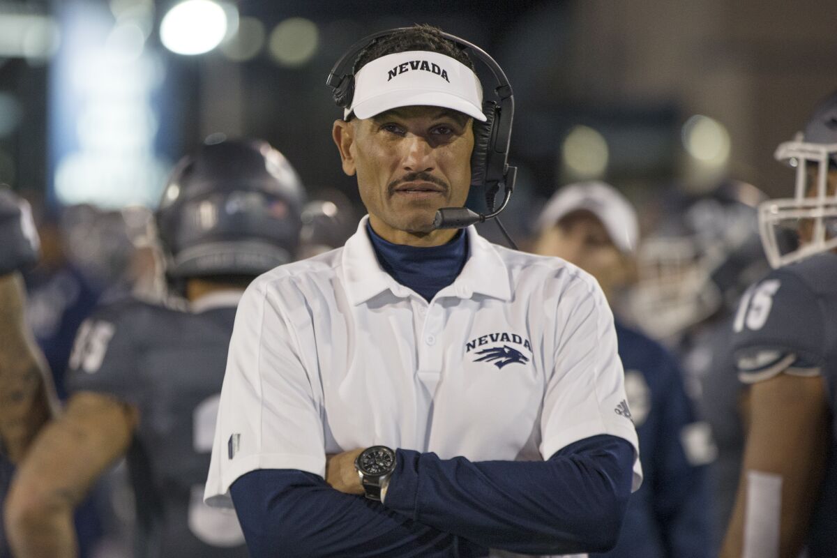 FILE - In this Nov. 2, 2019, file photo, Nevada head coach Jay Norvell works the sideline during the second half of an NCAA college football game against New Mexico in Reno, Nev. A person with knowledge of the decision says Colorado State has hired Nevada head coach Jay Norvell to lead the Rams.(AP Photo/Tom R. Smedes, File)