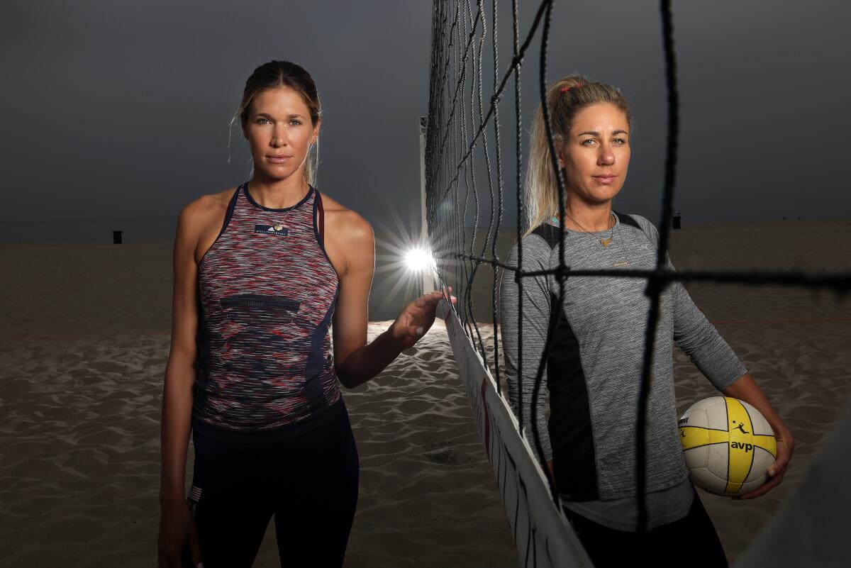 Alix Klineman, left, and April Ross are photographed before practice in Hermosa Beach in preparation for the AVP Manhattan Beach Open on Tuesday.