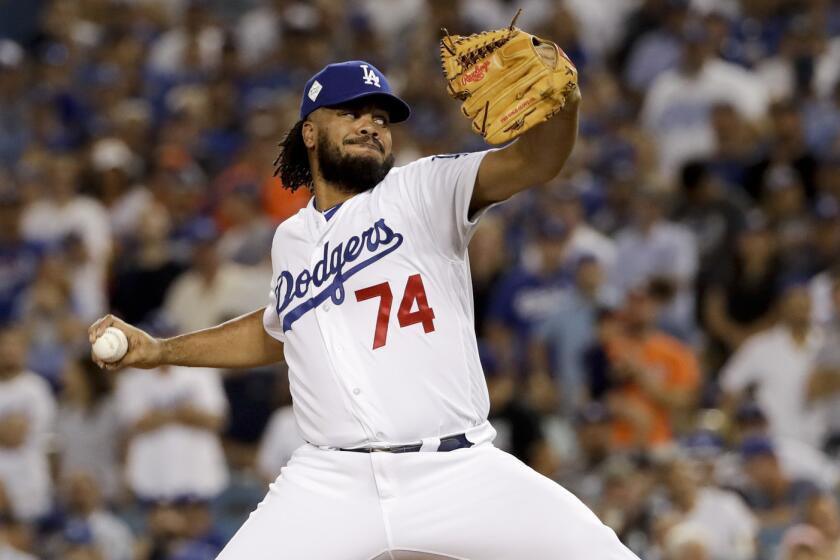 Los Angeles Dodgers closer Kenley Jansen delivers a pitch against the Houston Astros in the top of the eighth inning of Game 2 of the World Series at Dodger Stadium.