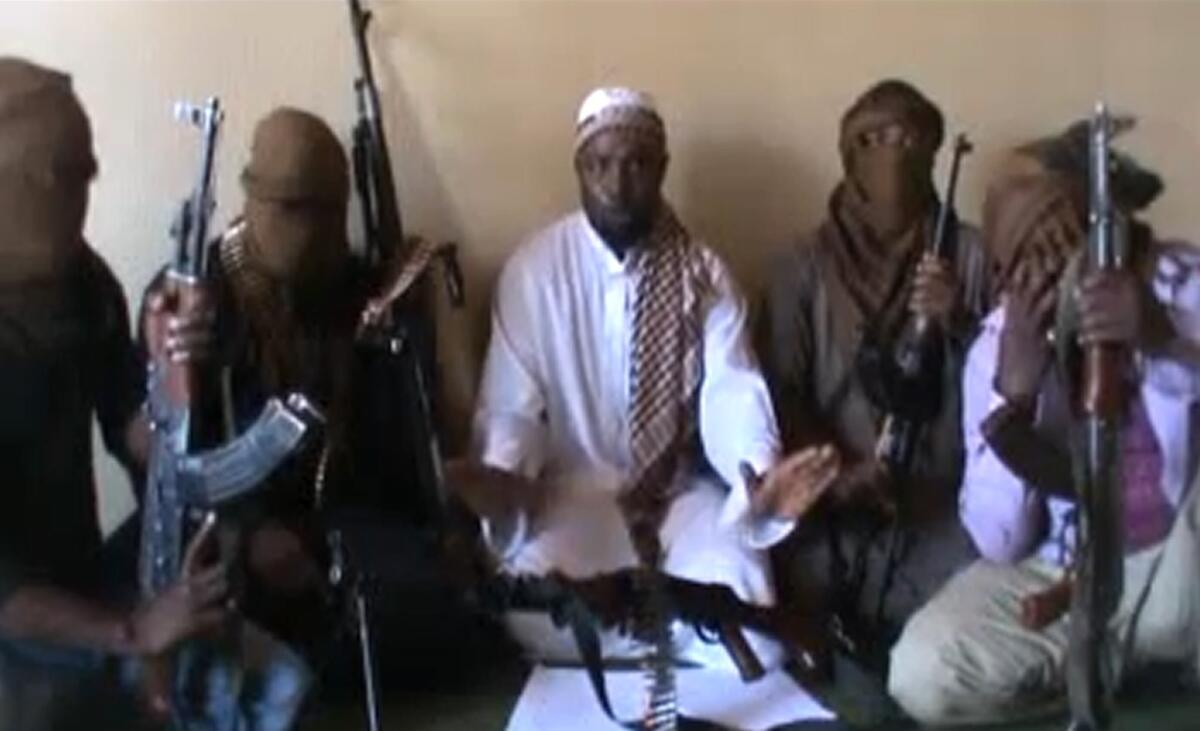 Residents of Chibok, Nigeria, say the militant group Boko Haram abducted dozens of schoolgirls from their boarding school in the middle of the night. Above, a screen capture of a video posted on YouTube in April 2012 that purports to show members of Boko Haram.