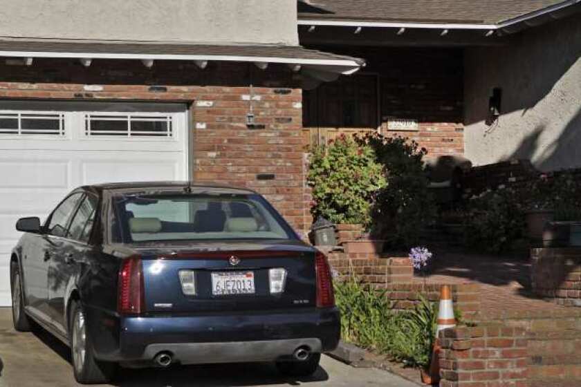 The 2005 Cadillac is parked at Patrick Lynch's home. The registration was put in his name in 2009.