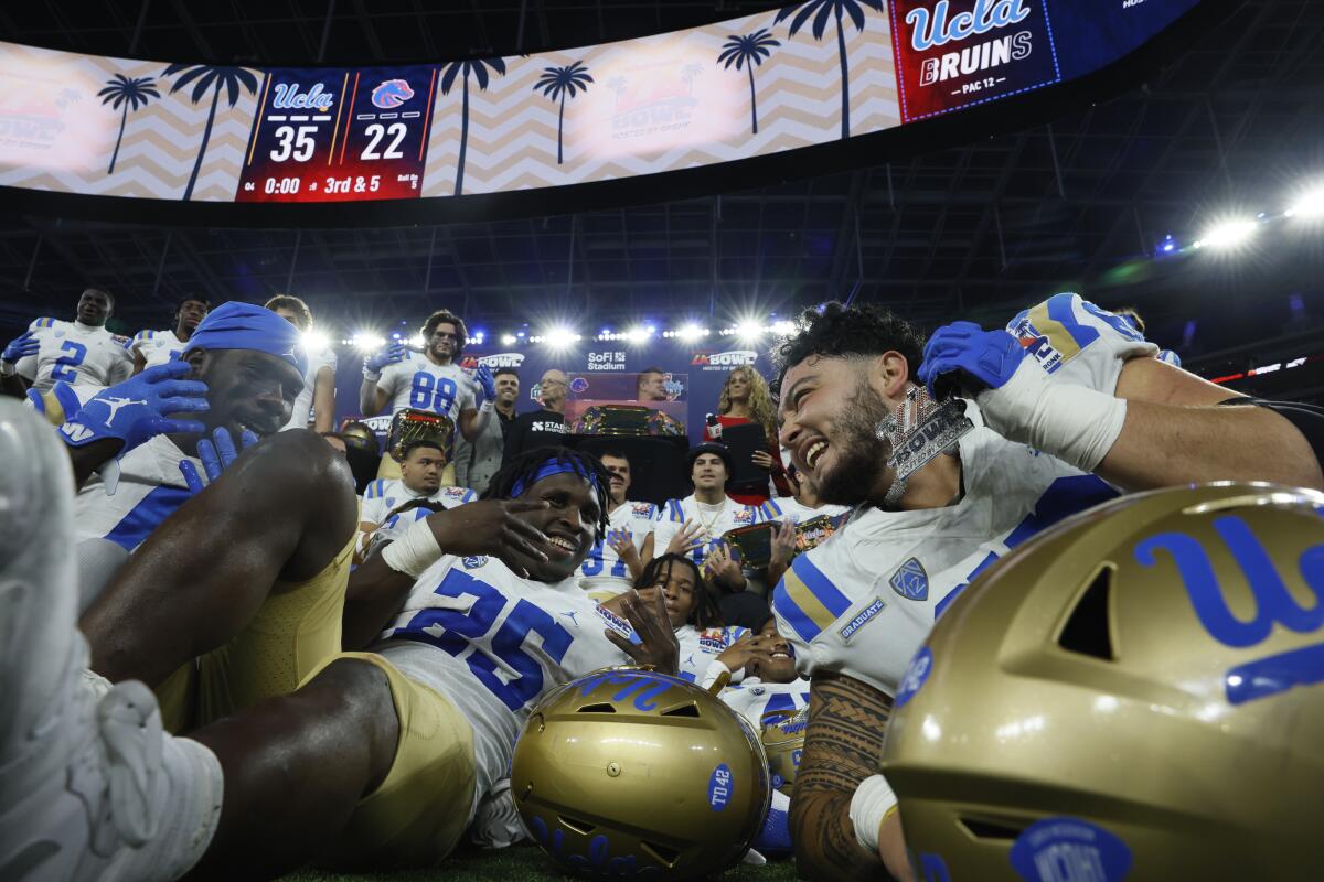 UCLA players celebrate after beating Boise State in the LA Bowl at SoFi Stadium.
