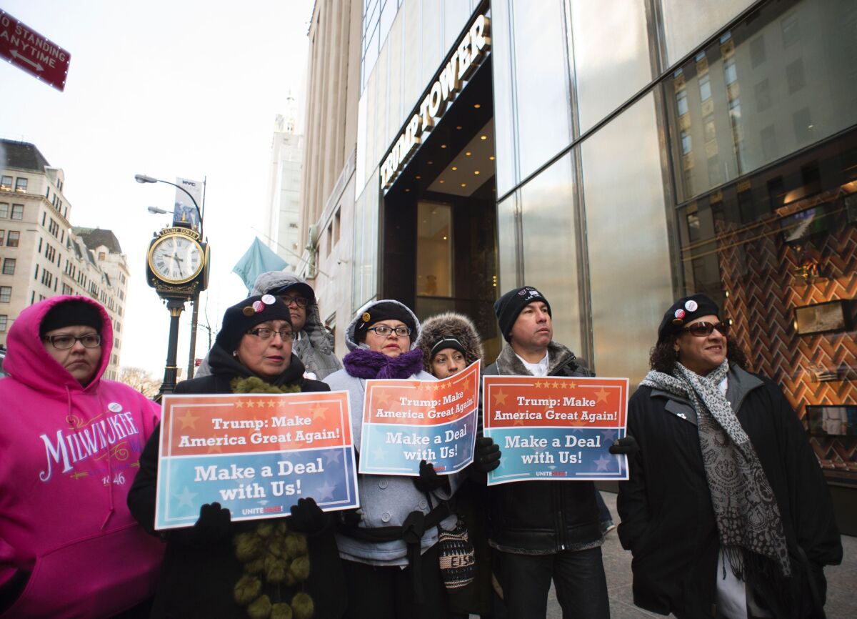 Protesters from Trump International Hotel in Las Vegas gather outside Trump Tower in New York. The union workers delivered a petition inviting Donald Trump to the bargaining table to negotiate a contract.