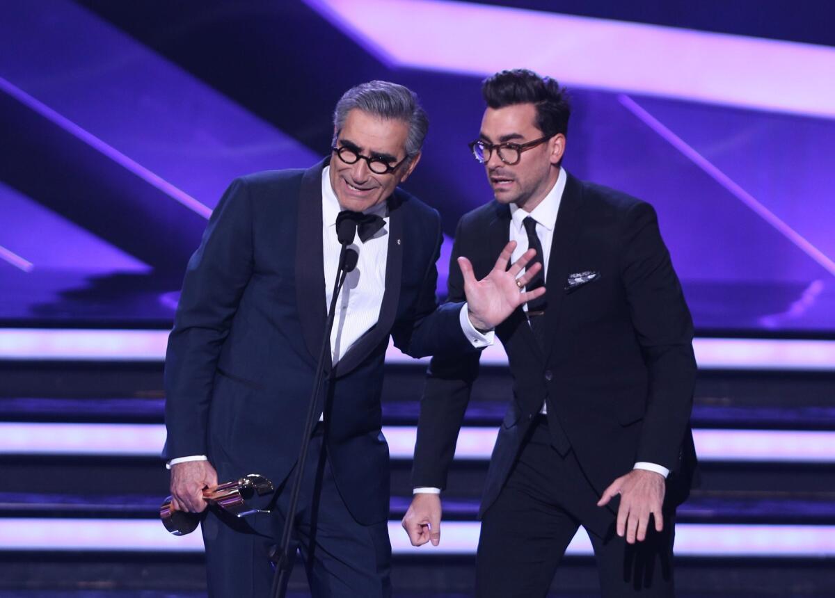 Eugene Levy, left, and his son Dan Levy accept the Best Comedy Series Award for "Schitt's Creek" at the Canadian Screen Awards in Toronto on March 13, 2016.