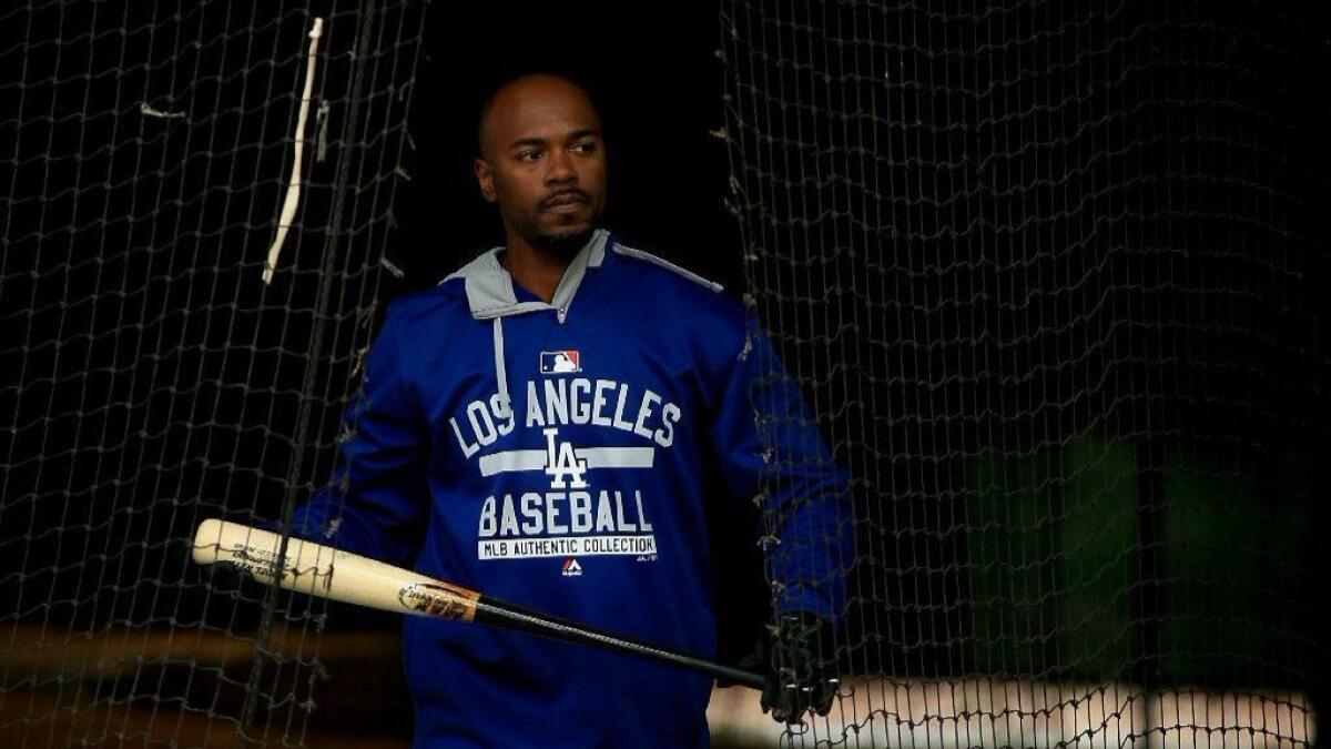 Dodgers infielder Jimmy Rollins takes batting practice during spring training in 2015.