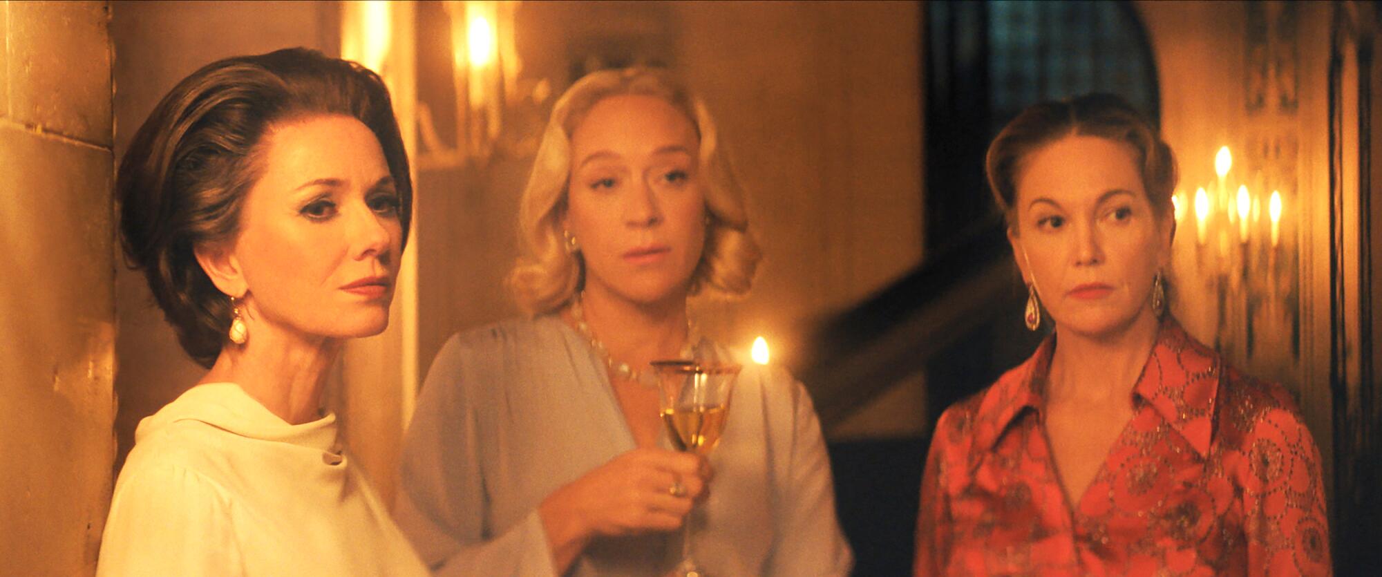 Naomi Watts, left, Chloe Sevigny and Diane Lane look disapproving in a scene from "Feud: Capote vs. the Swans."