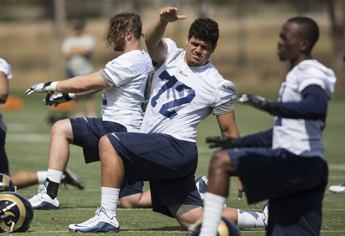 Rams rookies, including defensive lineman Ian Seau (72), stretch during minicamp on May 6. Seau didn't make the Rams' roster.