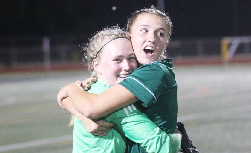 GoalkeeperJenna Gerraughty and Ryann Cull share a post-game moment.