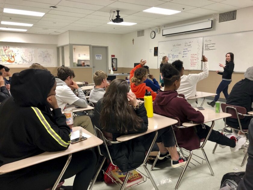 Instructors from Raphael House lead a classroom discussion about consent and healthy relationships with a class of sophomores at Central Catholic High School in Portland, Ore., on April 15, 2019.