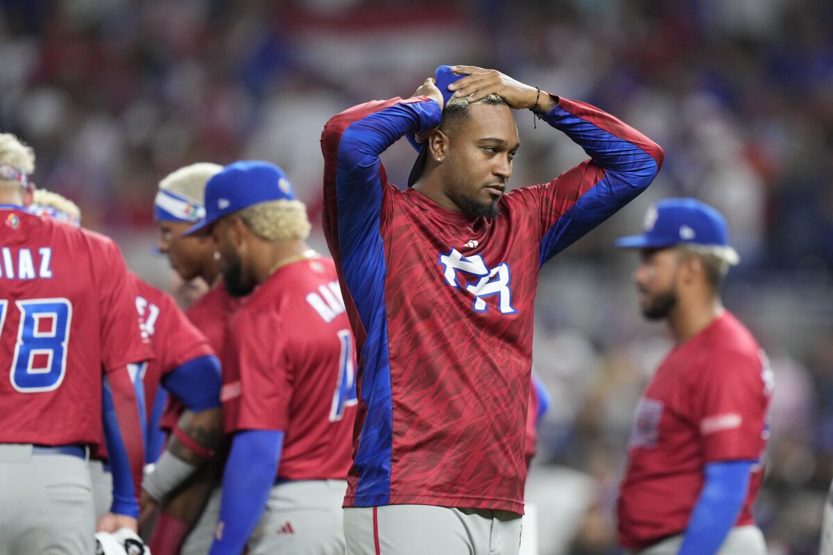 Puerto Rico players react after pitcher Edwin Diaz appeared to be injured during a postgame celebration.