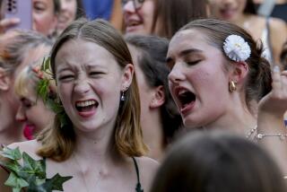 Swifties sing and dance in Vienna on Friday, Aug.9, 2024. Organizers of three Taylor Swift concerts in the stadium in Vienna this week called them off on Wednesday after officials announced arrests over an apparent plot to launch an attack on an event in the Vienna area such as the concerts. (AP Photo/Heinz-Peter Bader)