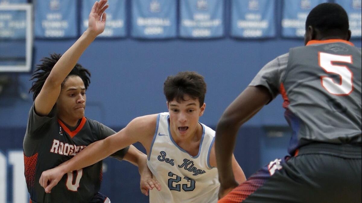 Corona del Mar High's Jack Stone, pictured driving past two Eastvale Roosevelt defenders on Dec. 5, 2018, led the Sea Kings to a 63-36 win over Marina on Wednesday.
