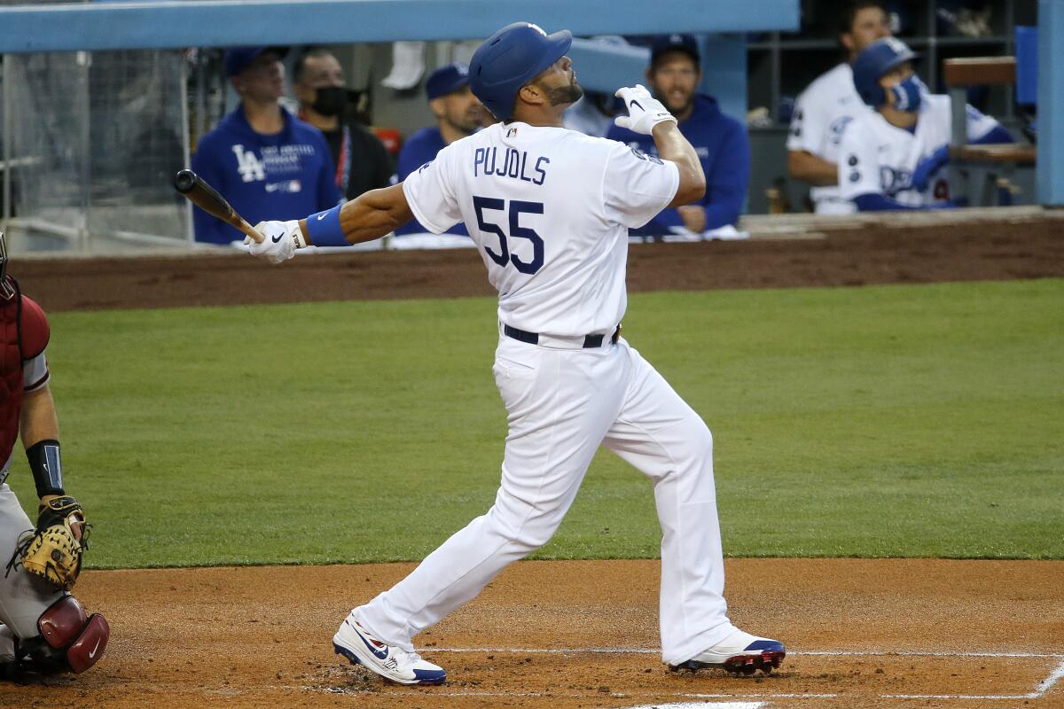 Dodgers first baseman Albert Pujols flies out to the outfield.