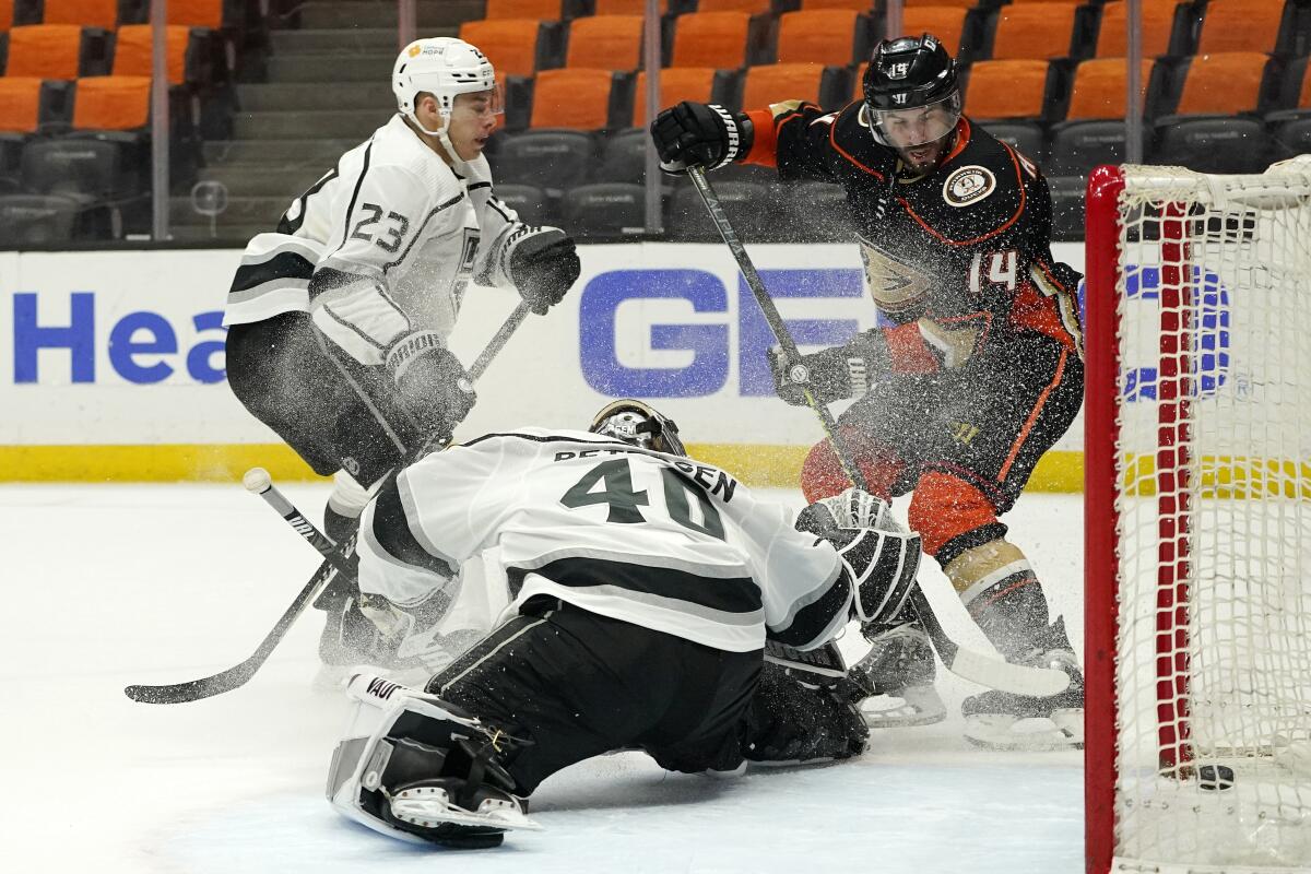 Ducks center Adam Henrique scores in overtime against Kings goalie Cal Petersen on March 8, 2021.