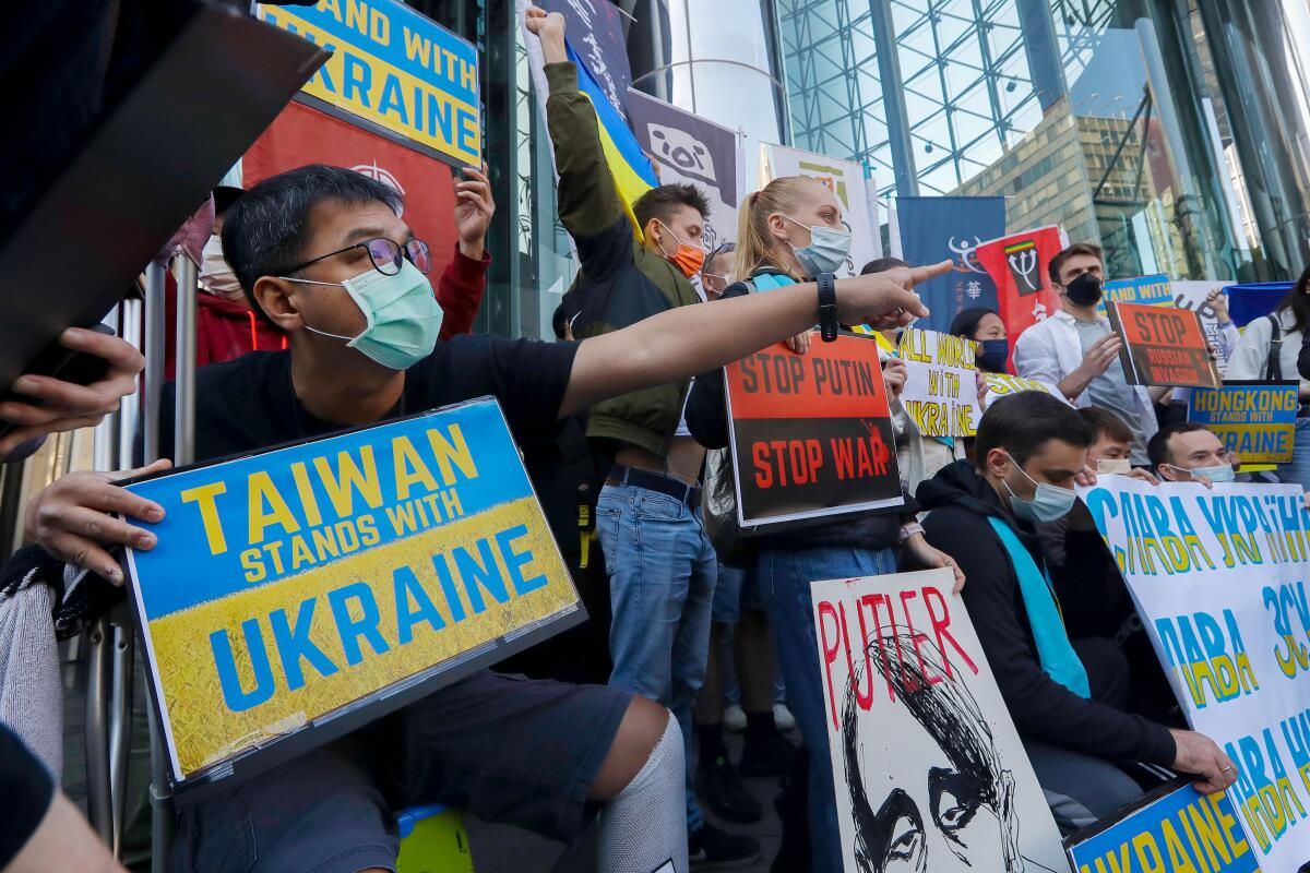 Protesters demonstrating against Russia's invasion of Ukraine