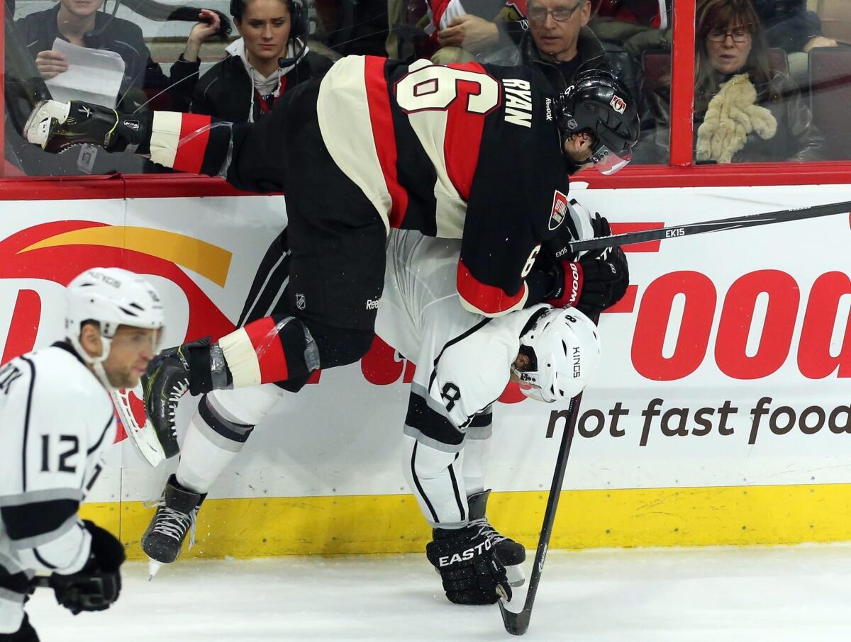 Senators' Bobby Ryan is checked by Drew Doughty during the second period of the Kings' win Tursday in Ottawa.
