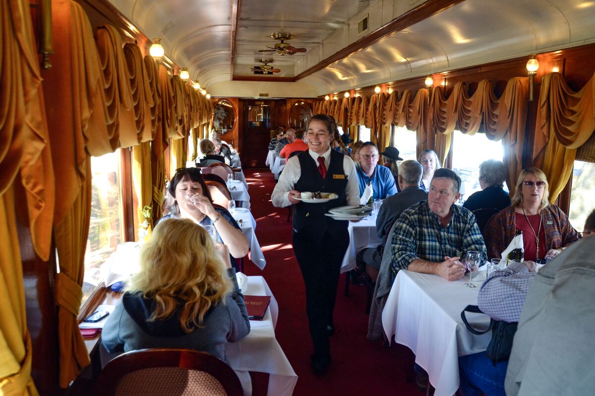 Food is delivered to tables in the gold-curtained Napa Valley Wine Train.
