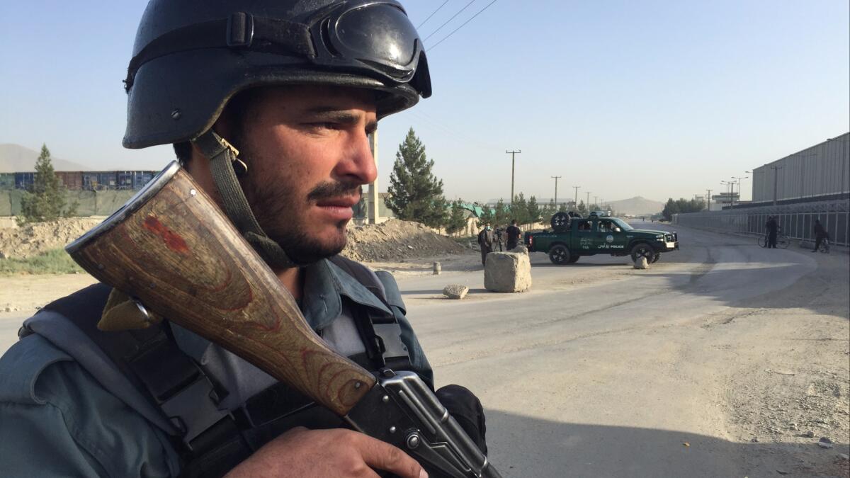 An Afghan police officer near the scene of an attack in Kabul, Afghanistan.