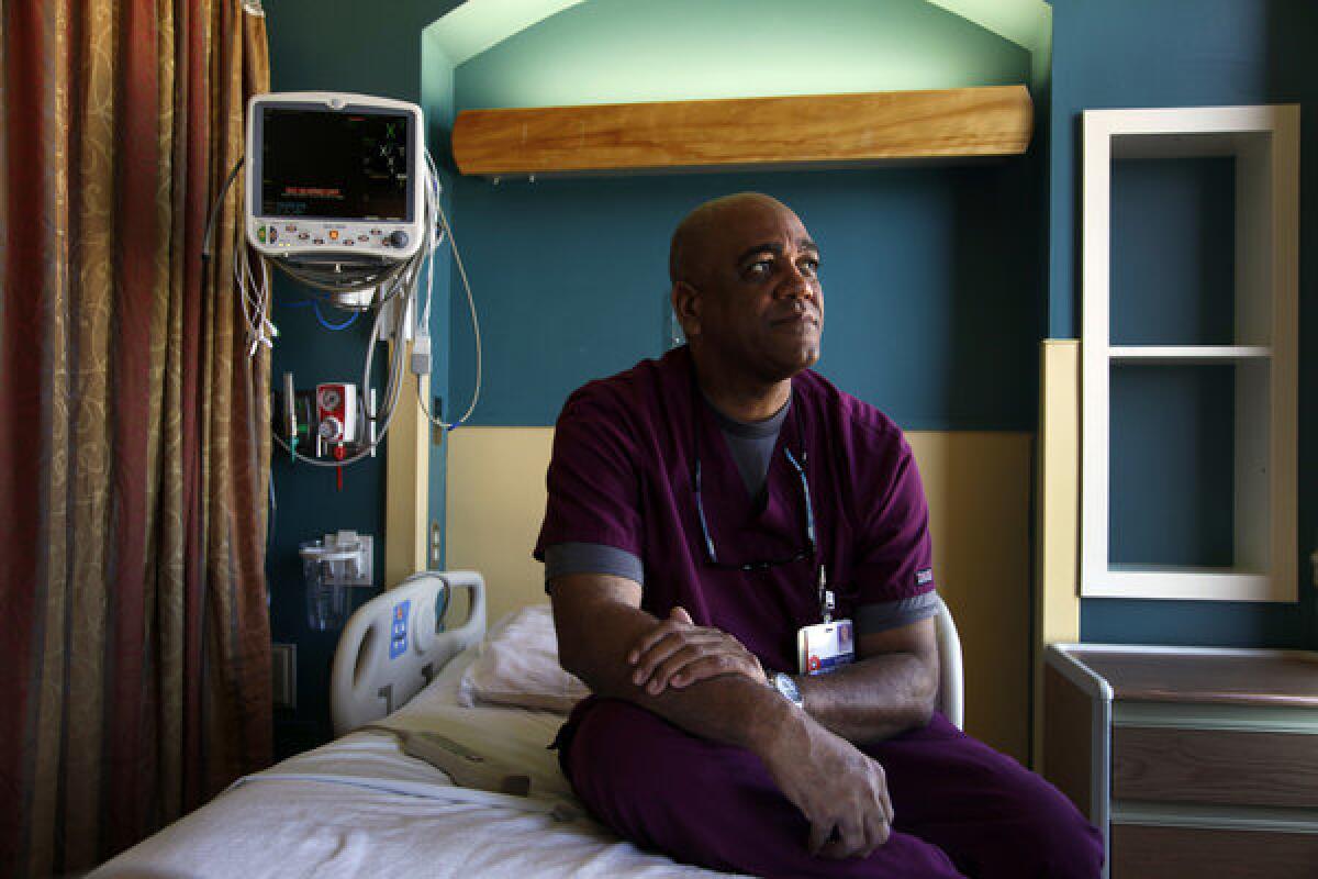 ALBUQUERQUE, CA-JULY 24, 2013: Gilberto Reyes had a brief career as a backstop for the Dodgers but that included arriving in Oakland from the Dominican Republic in time to get soaked in champagne after the Dodgers clinched a world championship. Reyes now works at a hospital in Albuquerque, New Mexico.(Photo by Michael Robinson Chavez/Los Angeles Times)