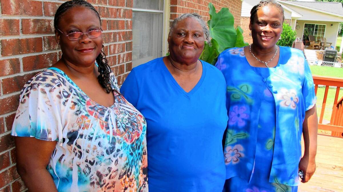 Alberta Currie, 78, with her twin daughters Linda, left, and Brenda. Currie has never had a birth certificate and fears she may be prevented from voting under North Carolina's restrictive new voter ID law.