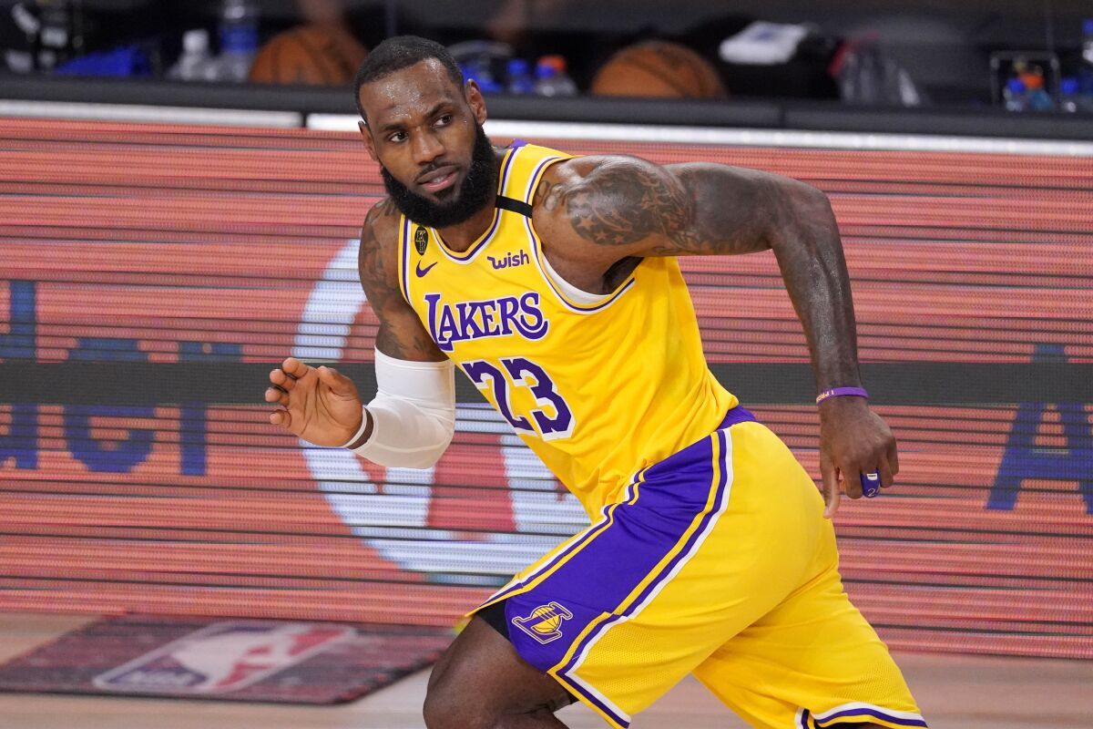 Lakers forward LeBron James runs on the court against the Denver Nuggets during Game 4.